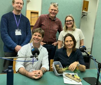 Duncan with Rare Earth team talking about soil