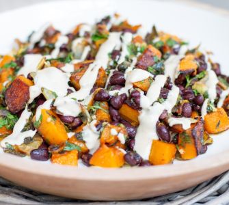 Vegan roasted squash with black beans and tahini