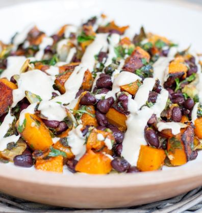 Vegan roasted squash with black beans and tahini